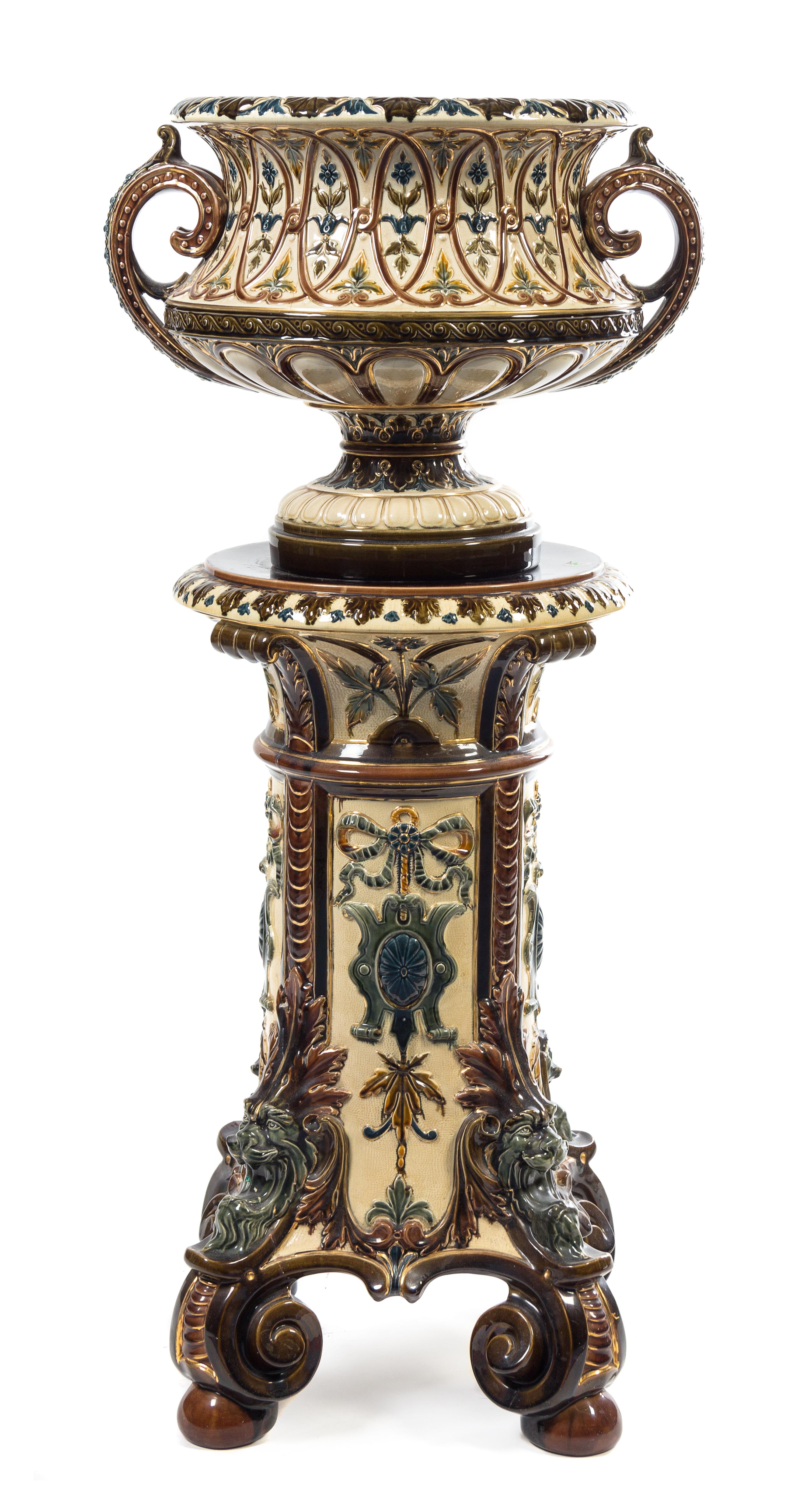 A Continental Majolica Urn and Pedestal Height overall 46 1/2 inches.