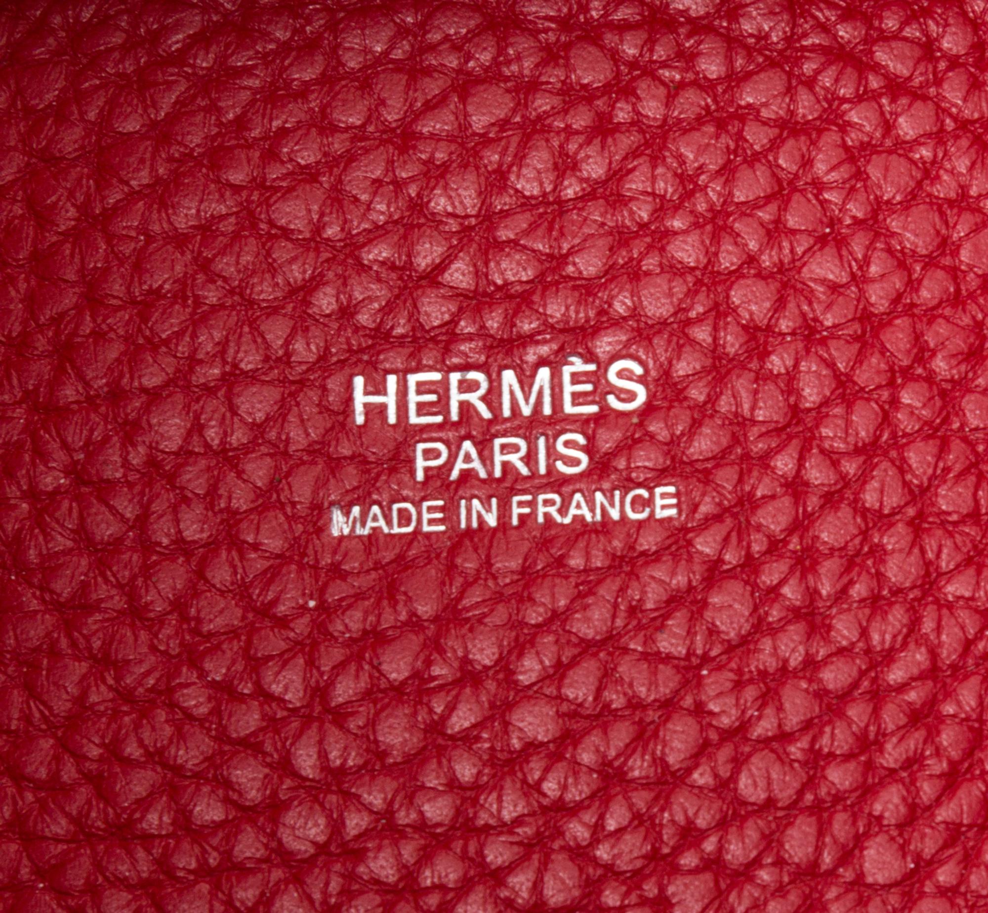 An Hermes Rouge Casaque Taurillon Clemence Picotin Lock TGM Handbag, 13" x 13" x 9".