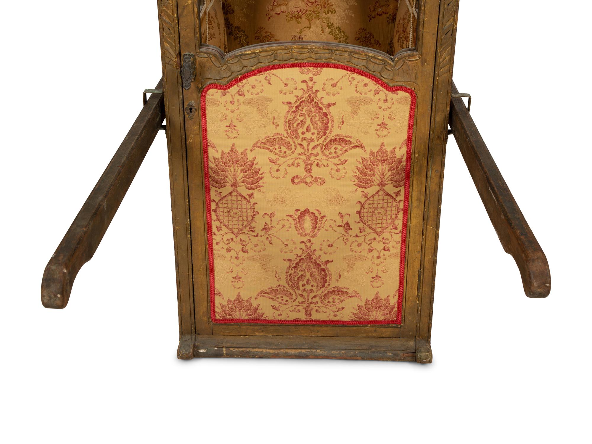 A Venetian Carved and Painted Giltwood Sedan Chair