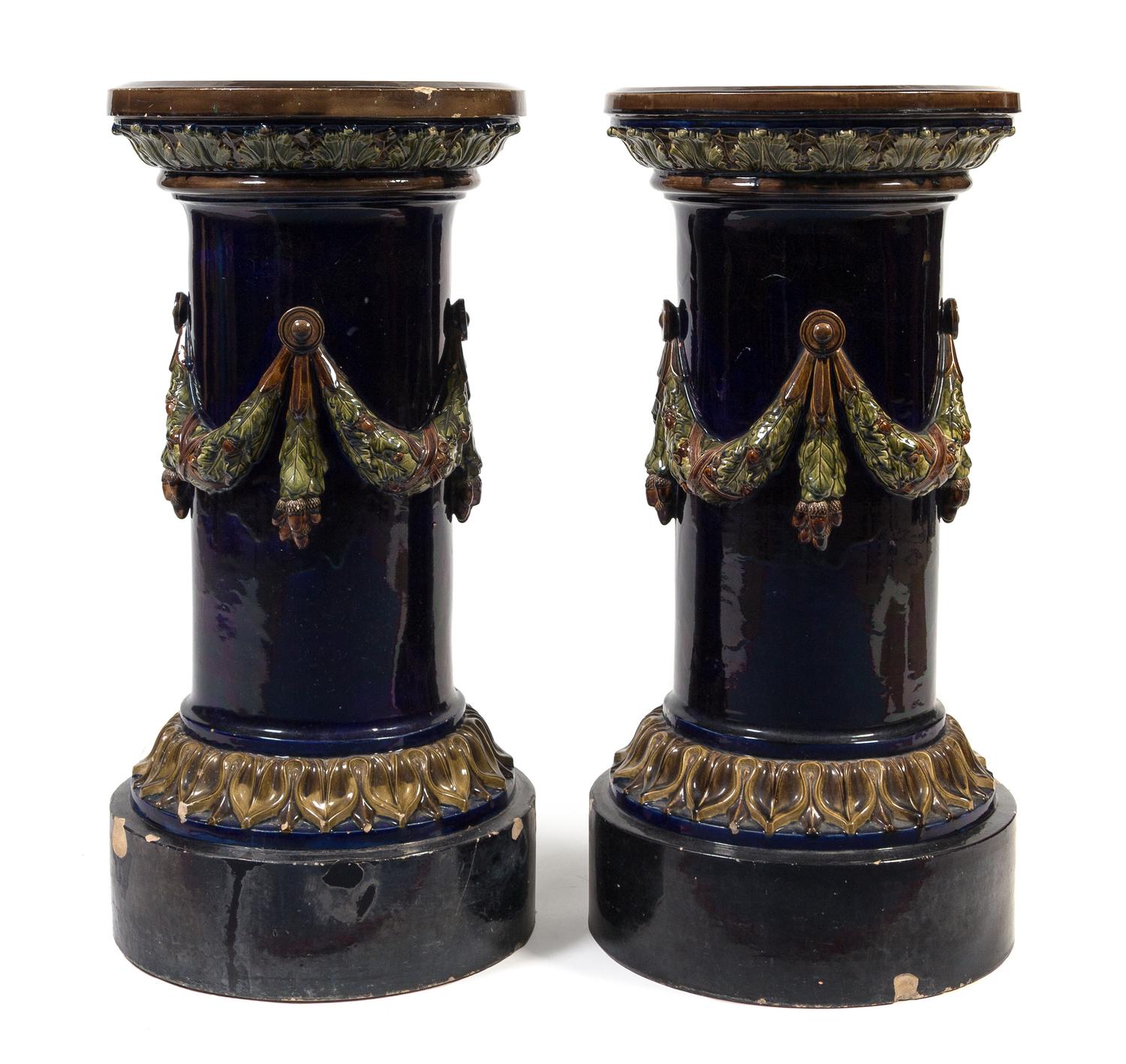 A Pair of Continental Majolica Pedestals Height 32 inches.