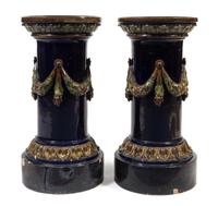 A Pair of Continental Majolica Pedestals Height 32 inches.