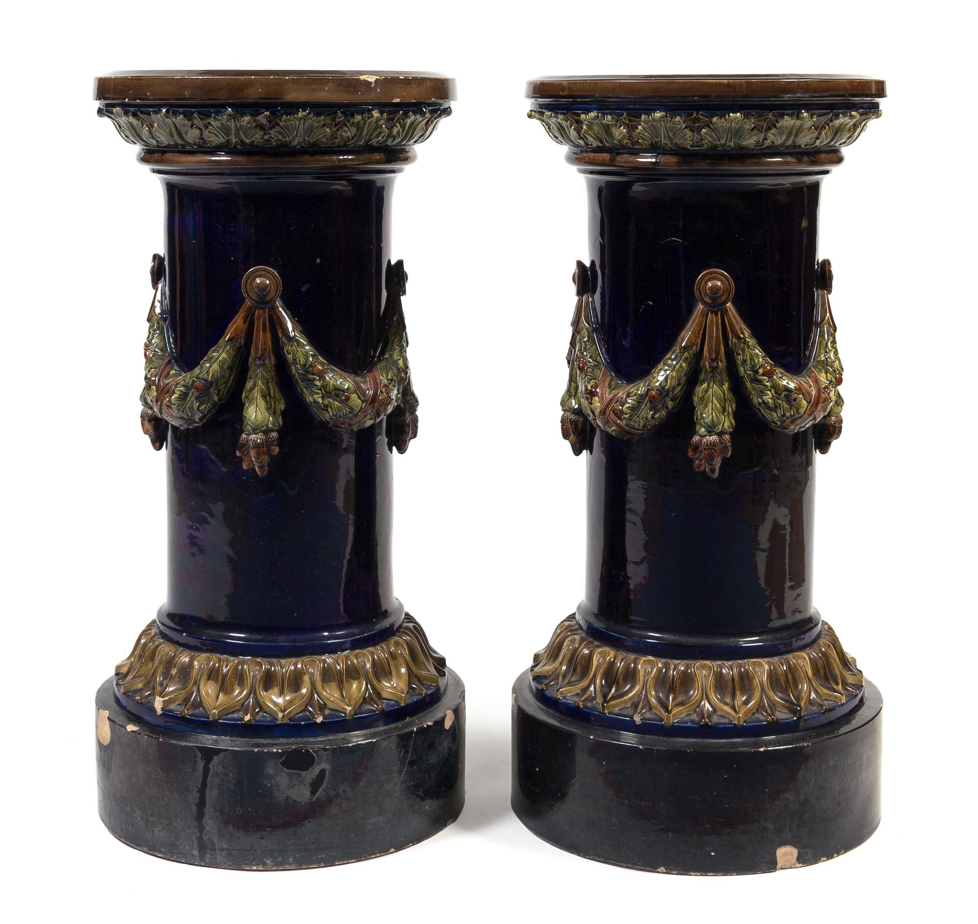 A Pair of Continental Majolica Pedestals Height 32 inches.