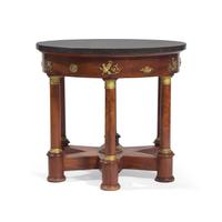 An Empire Flame Mahogany, Gilt-Metal Mounted and Marble-Top Center Table