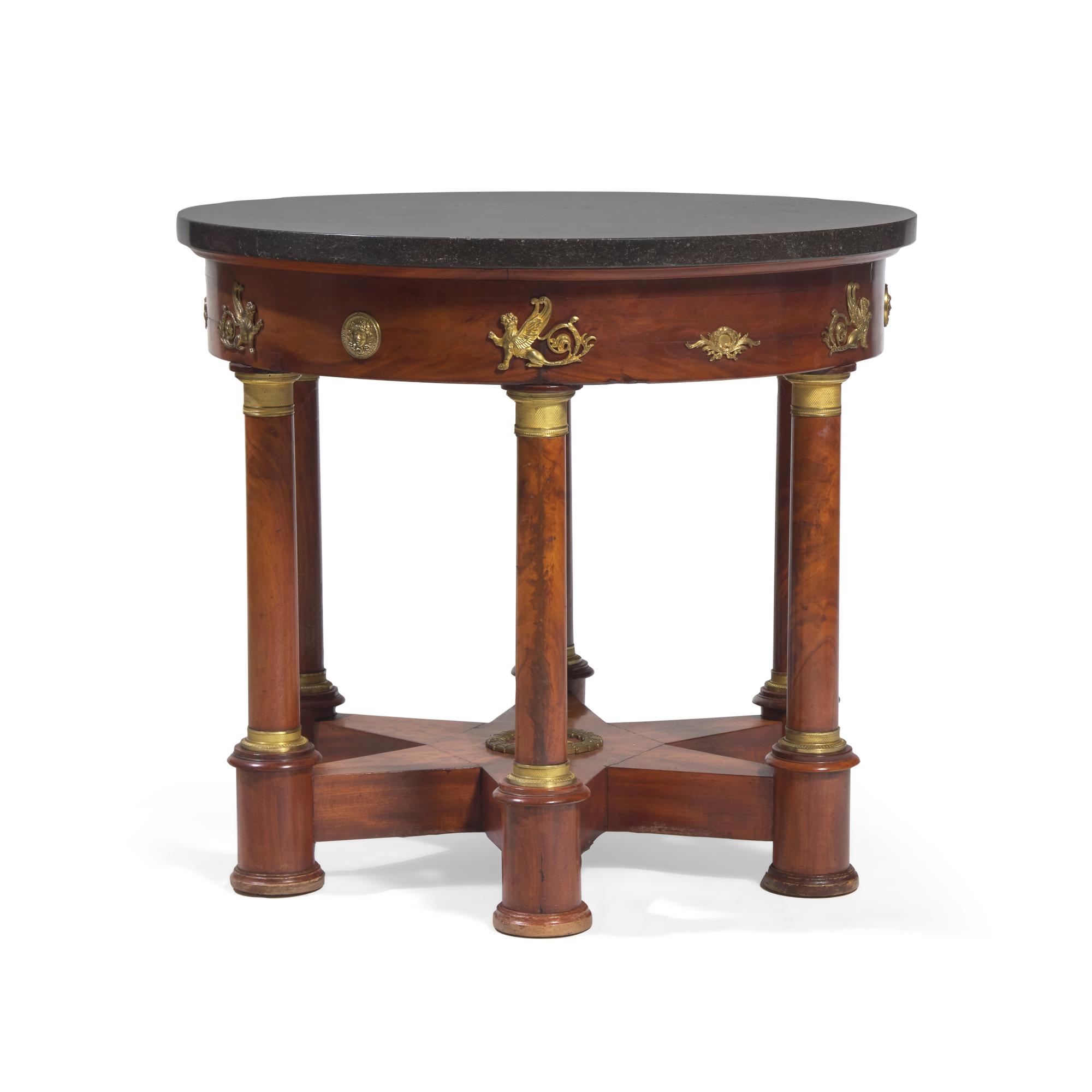 An Empire Flame Mahogany, Gilt-Metal Mounted and Marble-Top Center Table