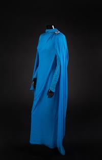 Dress and Shoes, 1982. Dress design by Paul Zastupnevitch, made by Western Costume Company in Los Angeles. — Worn by Olivia de Havilland for ‘The Night of a Hundred Stars II” at the Radio City Hall in New York in 1985. Also worn for the White House State Dinner given by Ronald Reagan in honor of President Francois Mitterand on March 22, 1984.