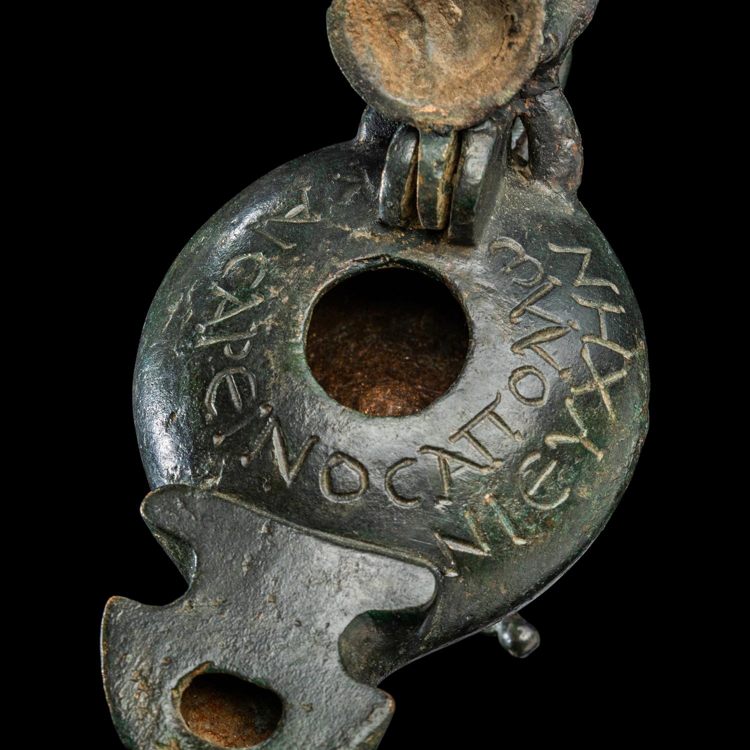 A Late Roman Bronze Lamp with Bull Head Handle and Greek Inscription