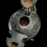 A Late Roman Bronze Lamp with Bull Head Handle and Greek Inscription