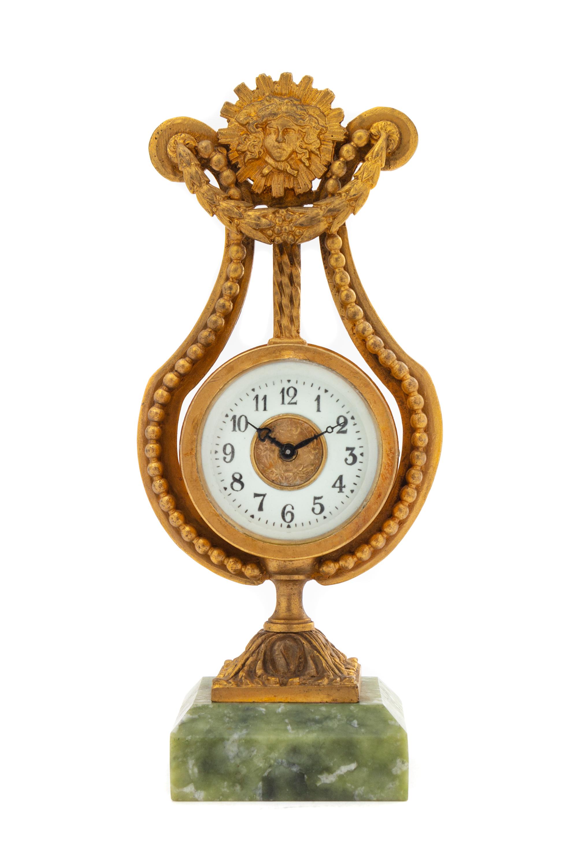 A French Gilt Metal and Hardstone Clock