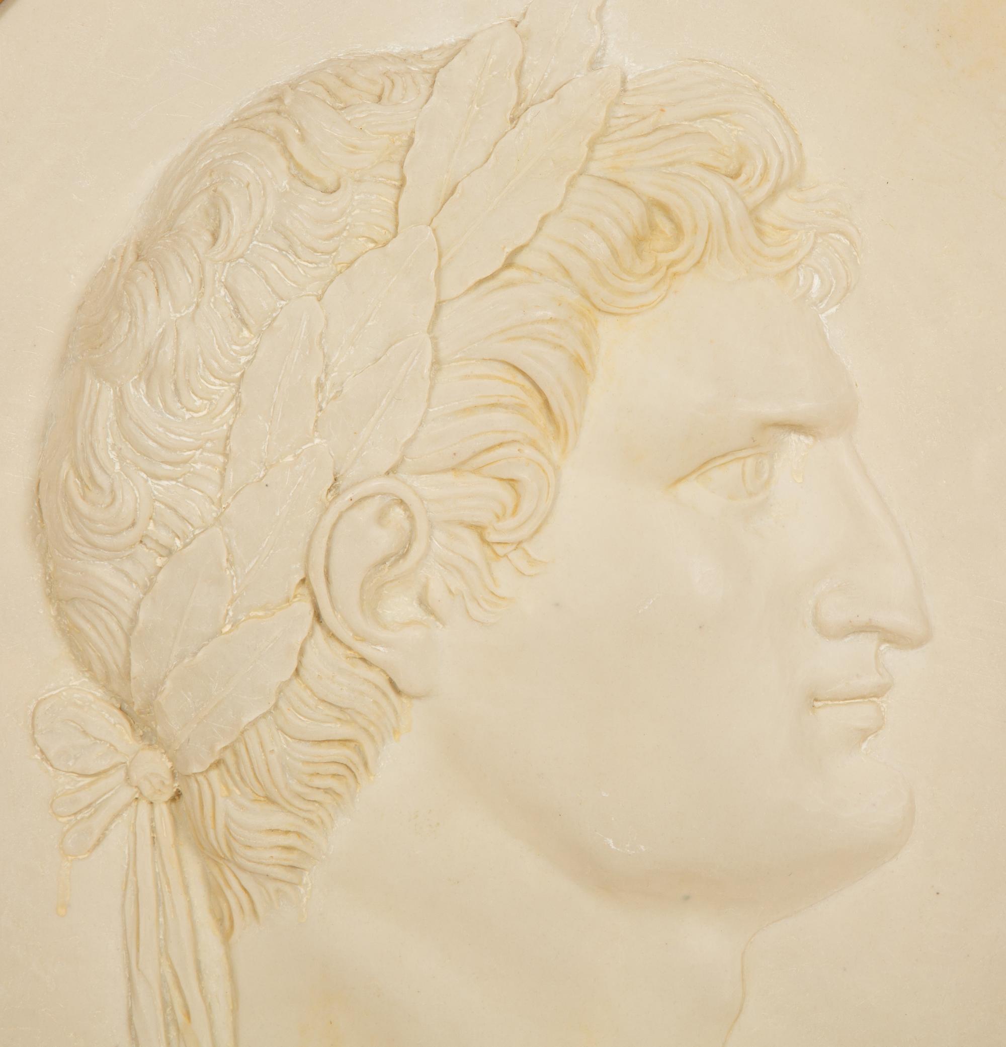 A Pair of Roman Style Composition Relief Plaques in Giltwood Frames