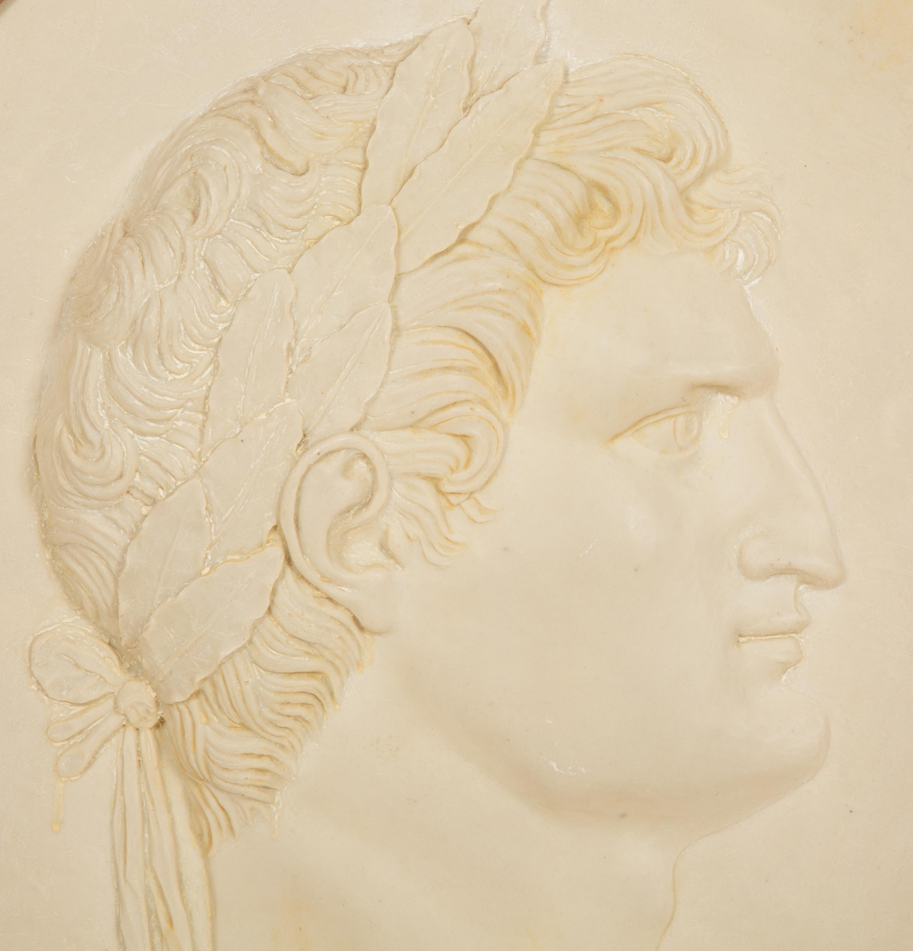 A Pair of Roman Style Composition Relief Plaques in Giltwood Frames