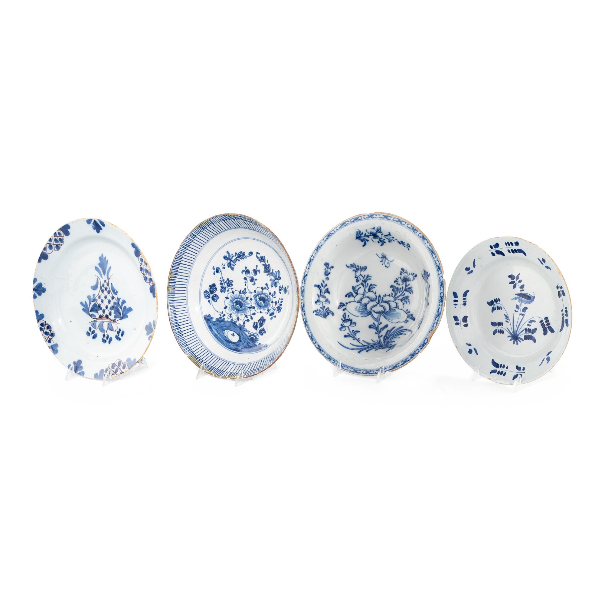 A Collection of Four Delft Blue and White Decorated Articles