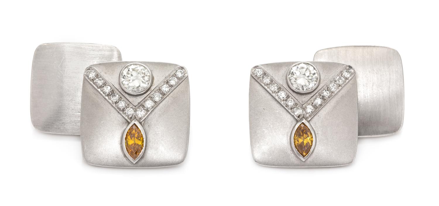 A Pair of Platinum, Diamond and Orange Diamond Cufflinks,