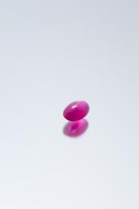 A 6.85 Carat Oval Cabochon Cut Star Ruby,