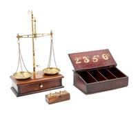 A Brass Balance and a Parcel Gilt Decorated Retail Cigar Box