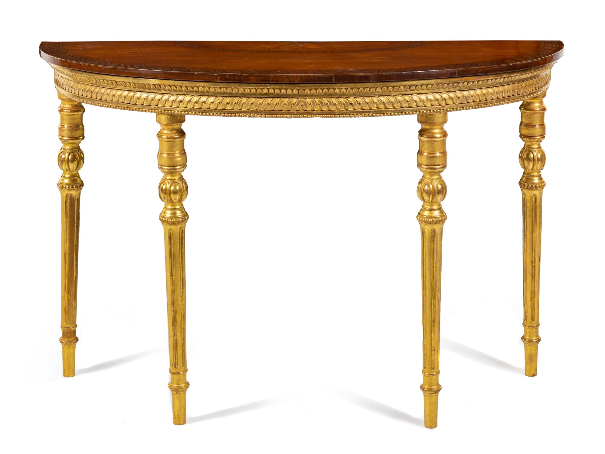 A George III Giltwood, Satinwood and Marquetry Console Table Height 33 3/4 x width 52 1/4 x depth 21 1/2 inches. — CIRCA 1780