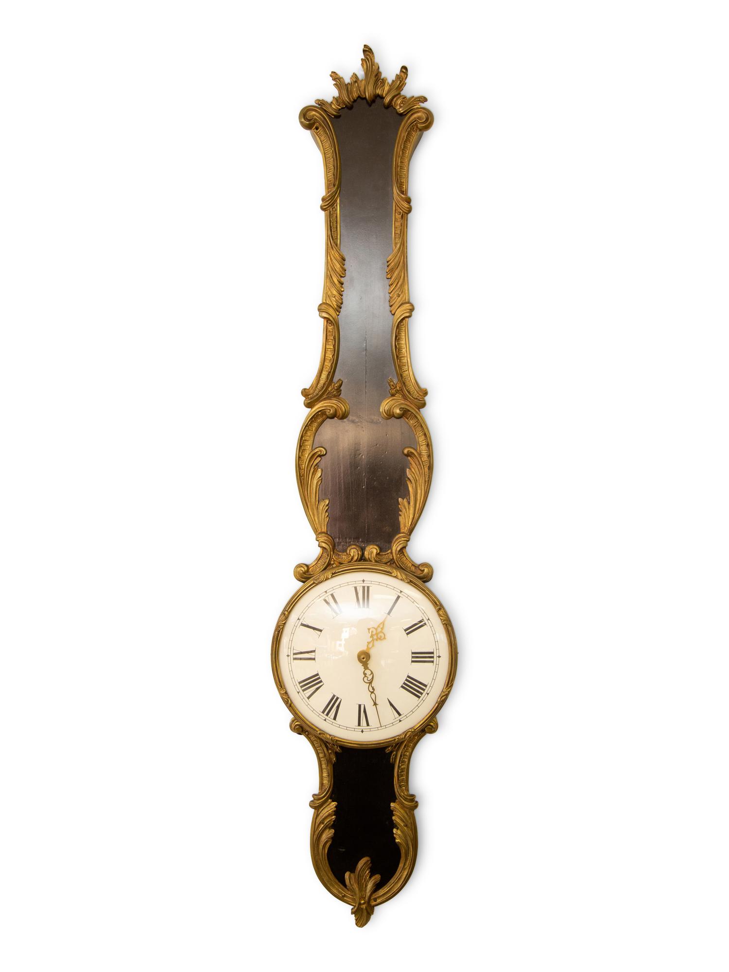 A French Empire Style Ebonized and Parcel Gilt Banjo Clock