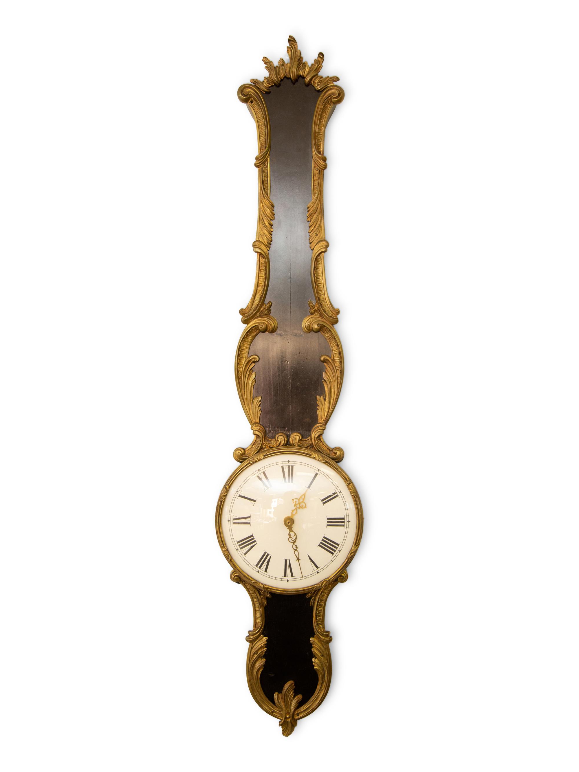 A French Empire Style Ebonized and Parcel Gilt Banjo Clock