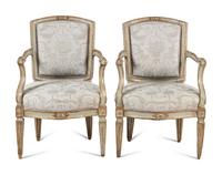 A Pair of Italian Neoclassical Painted and Parcel-Gilt Armchairs