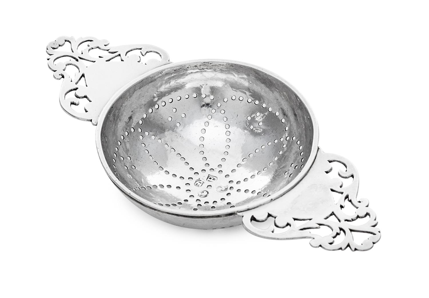 A George I Britannia Silver Lemon Strainer, Likely Robert Kempton, London, 1717, having twin openwork handles flanking the pierced bowl