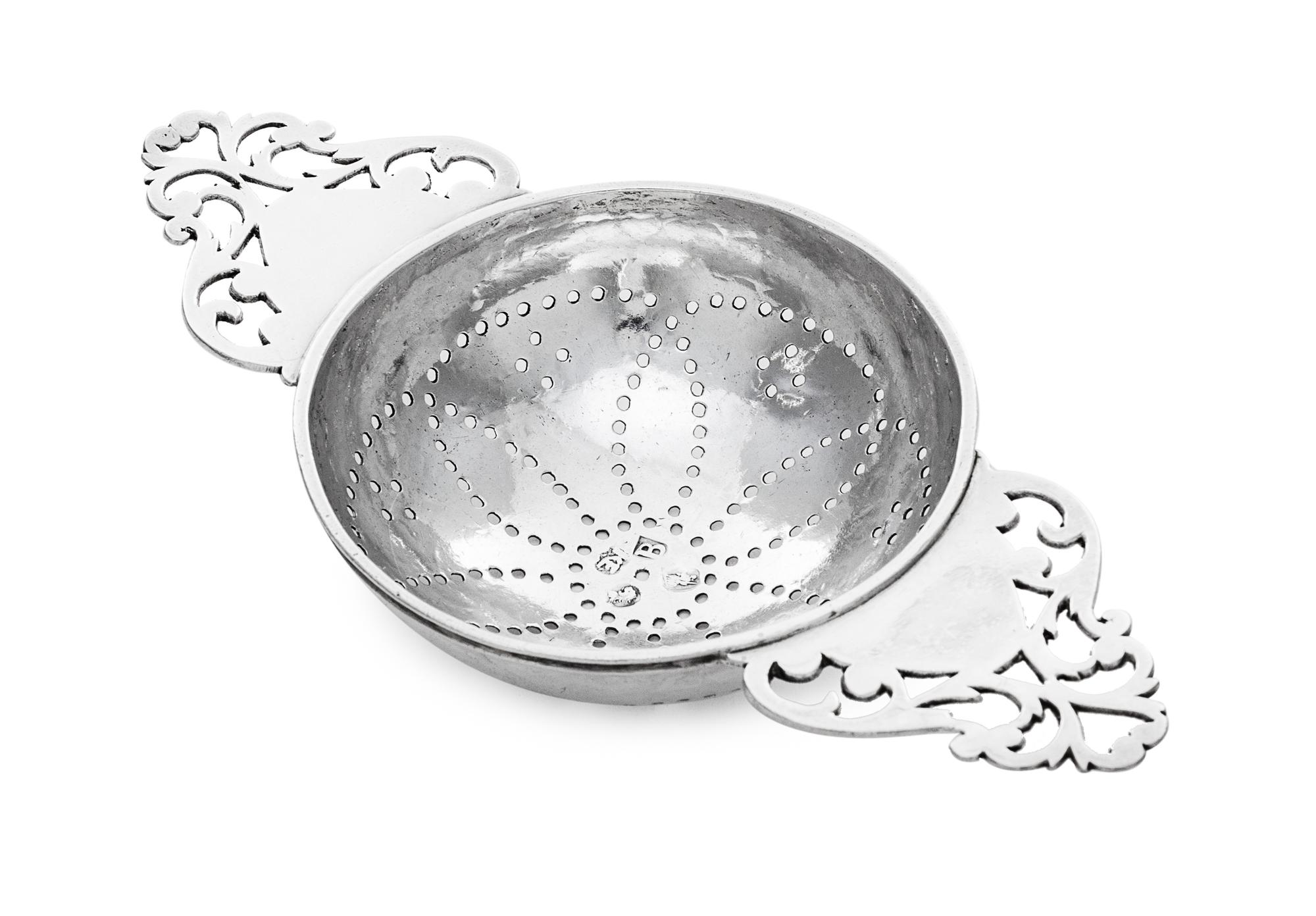 A George I Britannia Silver Lemon Strainer, Likely Robert Kempton, London, 1717, having twin openwork handles flanking the pierced bowl