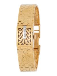 BUCHERER, 18K YELLOW GOLD AND DIAMOND SURPRISE WRISTWATCH