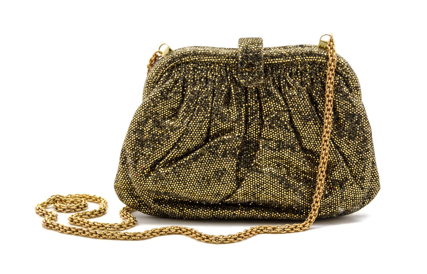 A Chanel Gold Glitter Evening Bag, 7 1/2 x 4 1/2 x 1 1/2 inches.