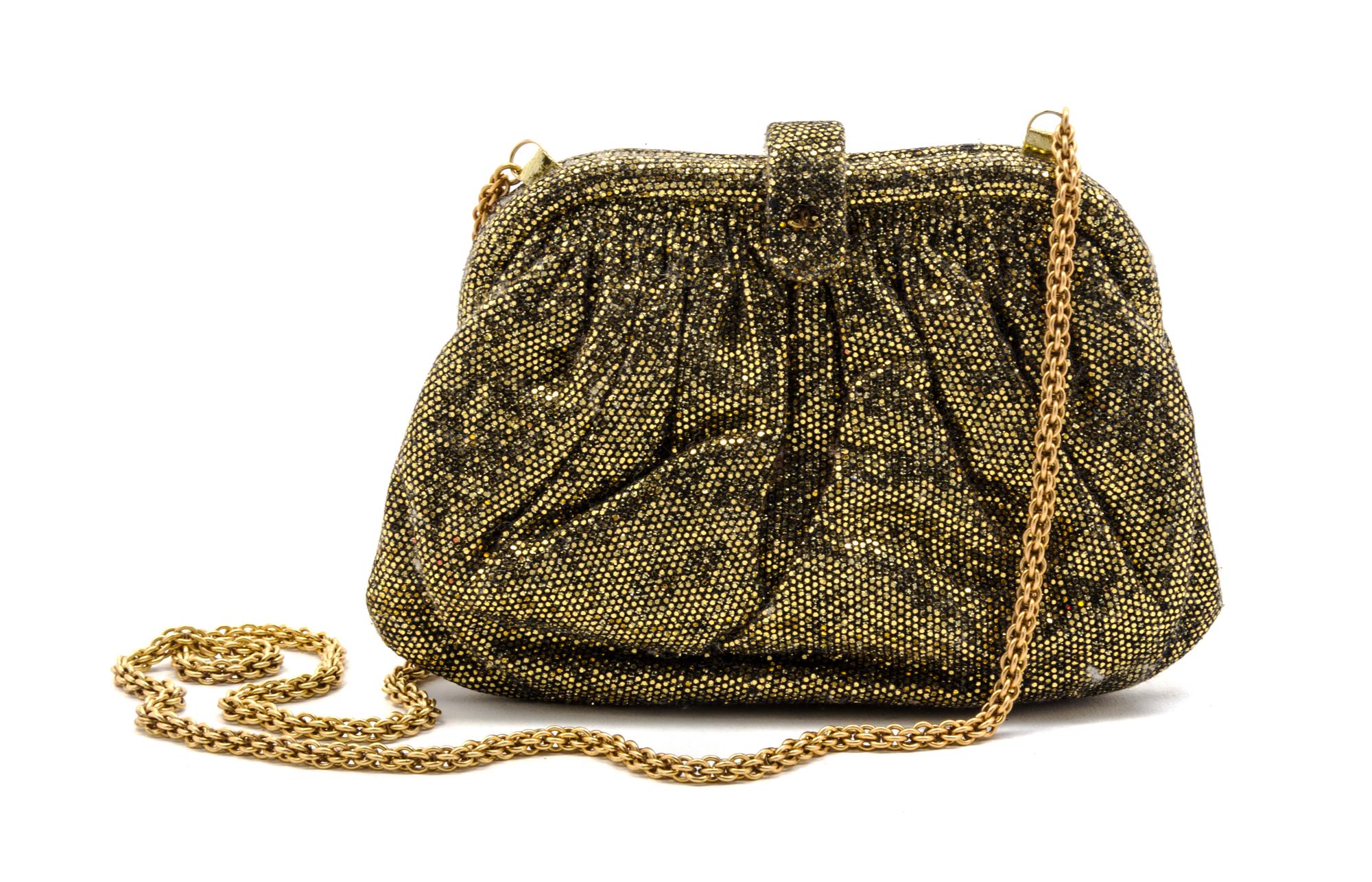 A Chanel Gold Glitter Evening Bag, 7 1/2 x 4 1/2 x 1 1/2 inches.