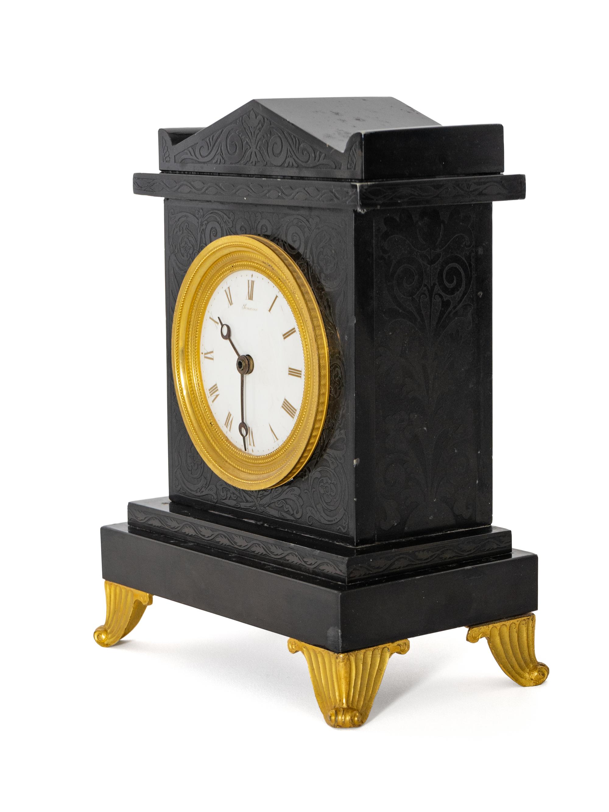 A Regency Black Slate and Gilt Bronze Mantel Clock