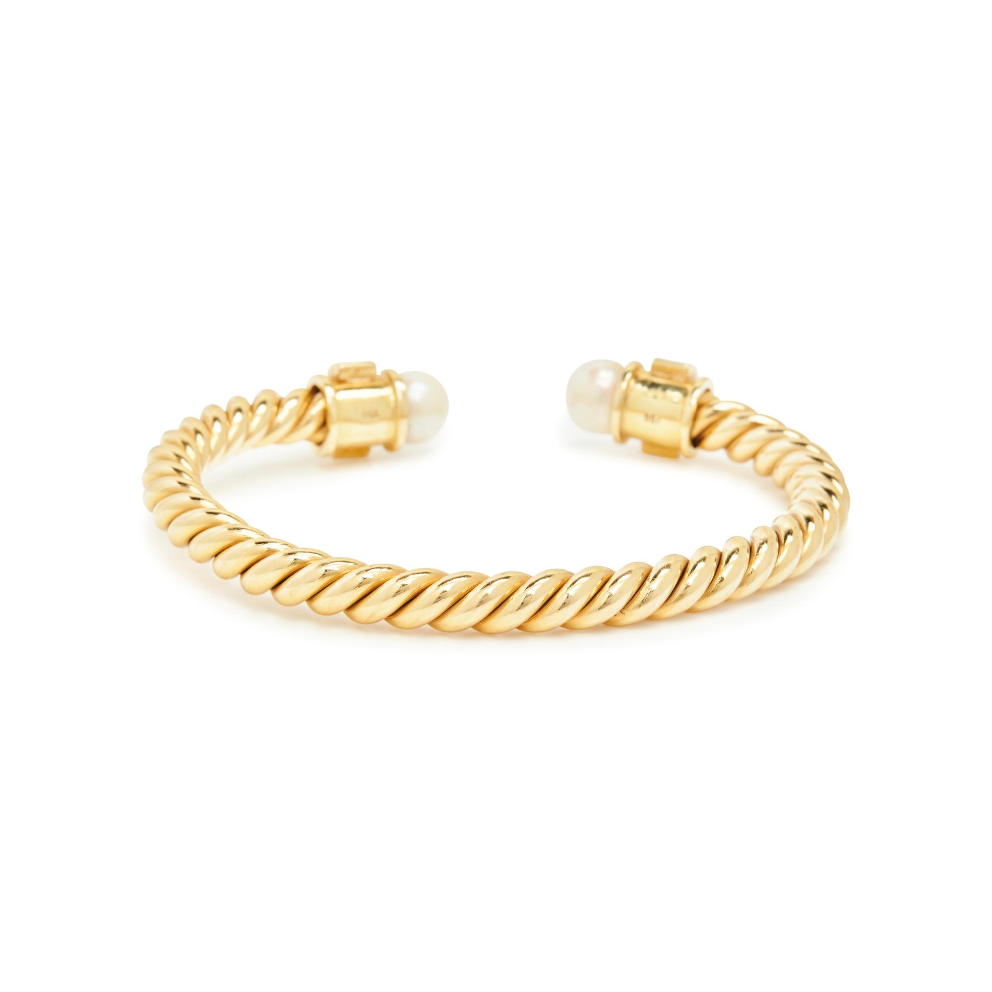 YELLOW GOLD, CULTURED PEARL, AND RUBY BANGLE BRACELET