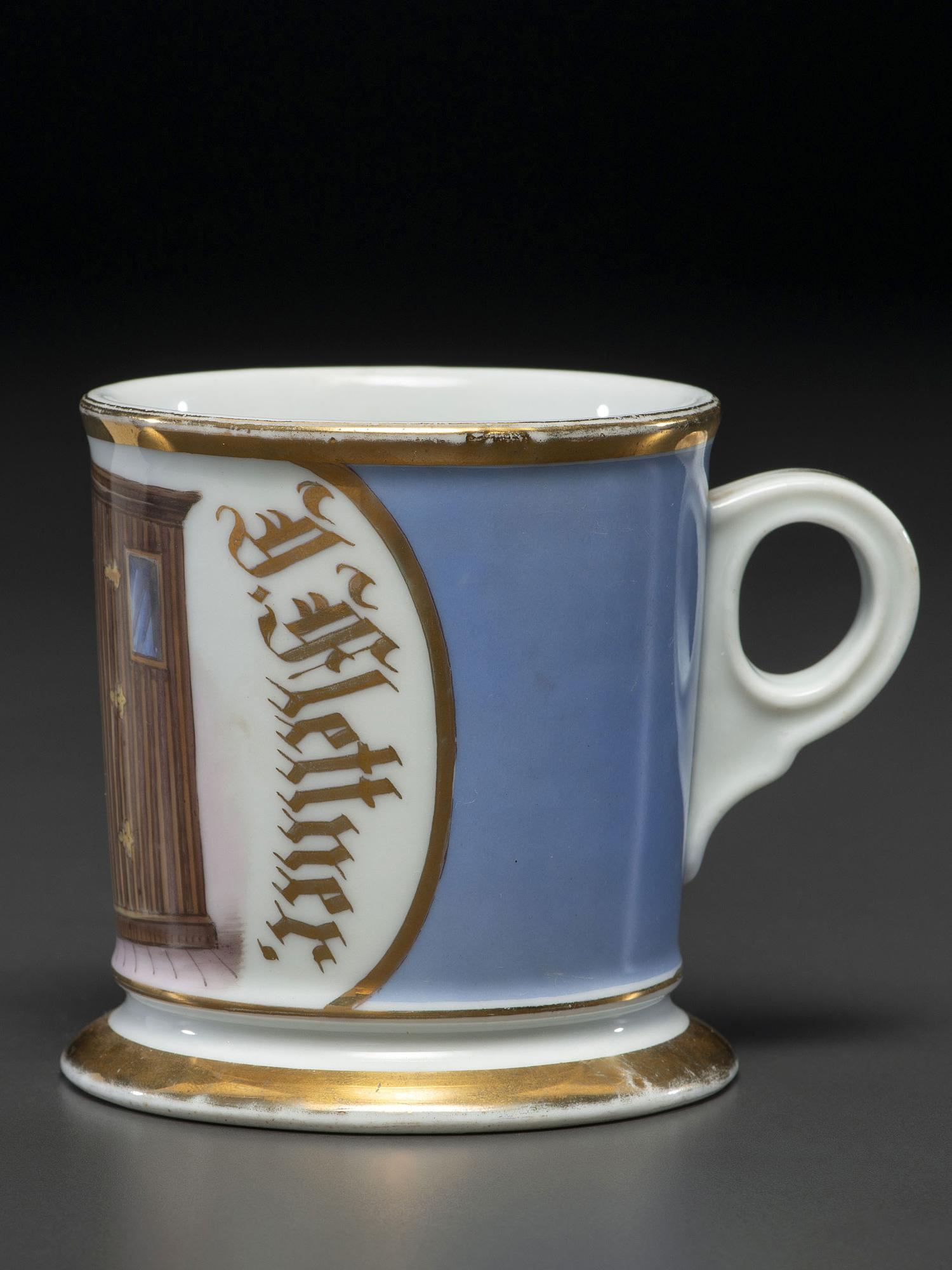 An Unusual Porcelain Shaving Mug Depicting an Icehouse