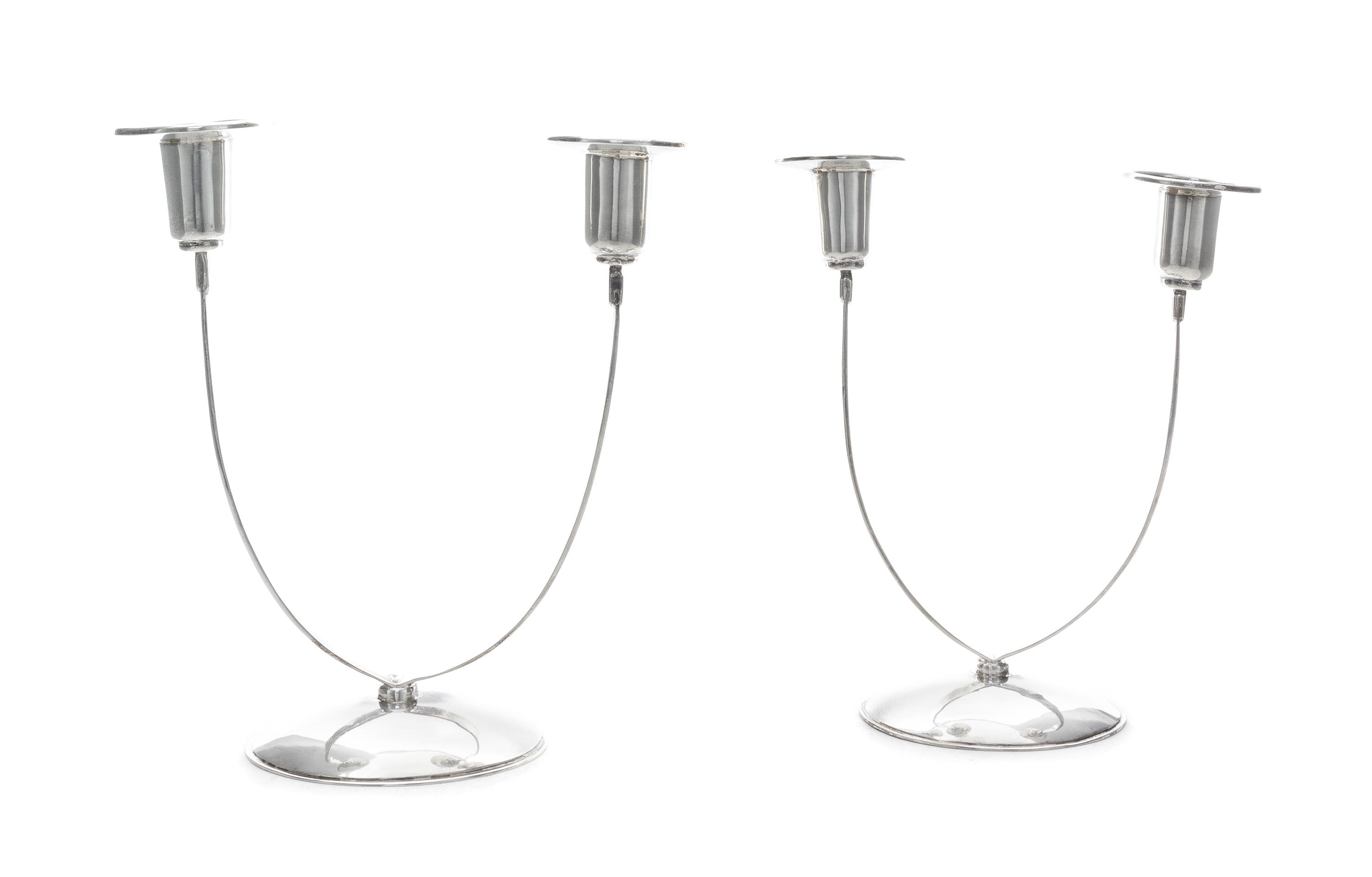 A Pair of American Silver Two-Light Candelabra, William Seitz, New York, NY, 1970, each having a domed foot supporting two strap branch