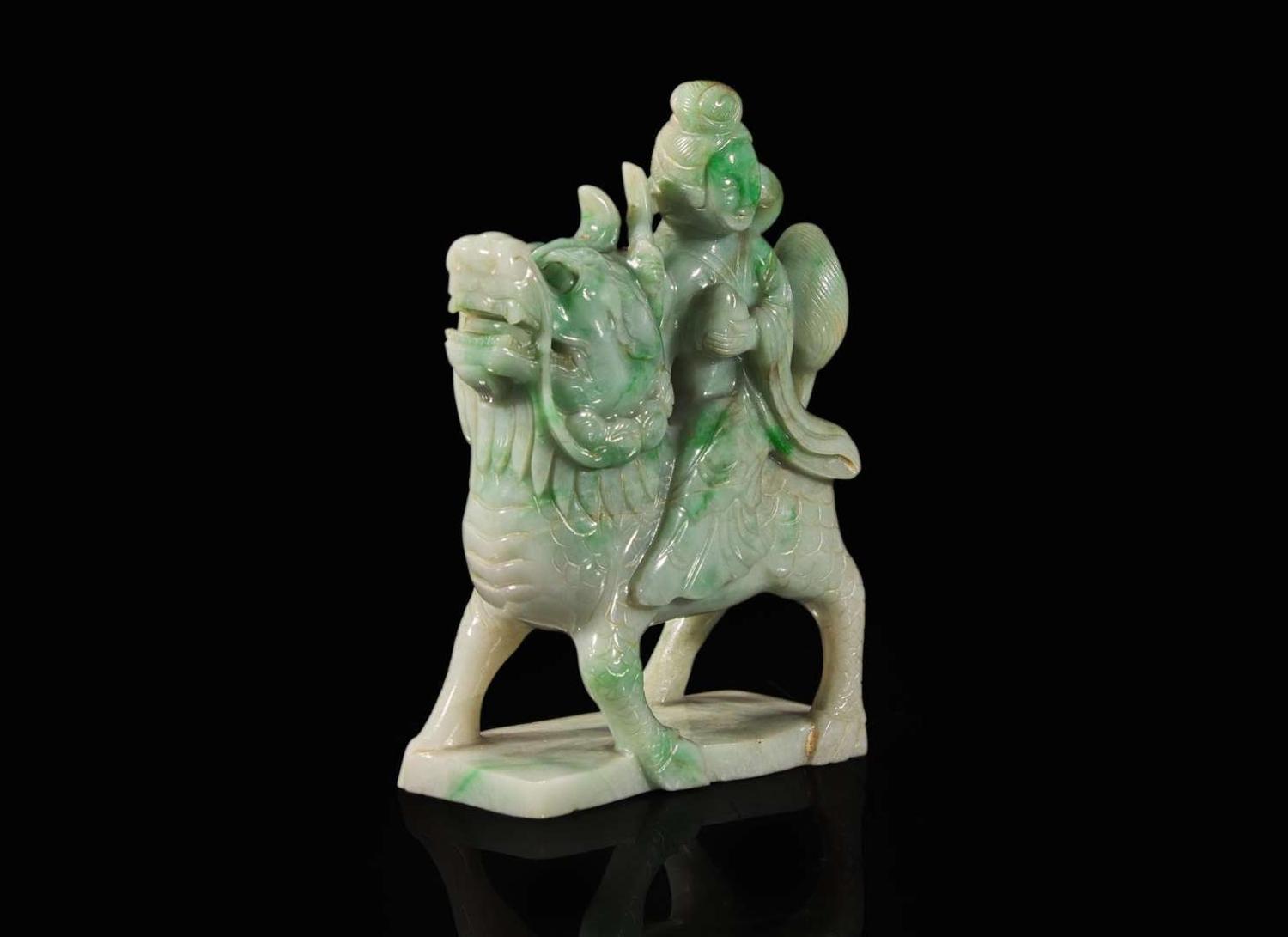 A Chinese jadeite figure of a meiren on a fabulous beast 翡翠雕仙人逸獸