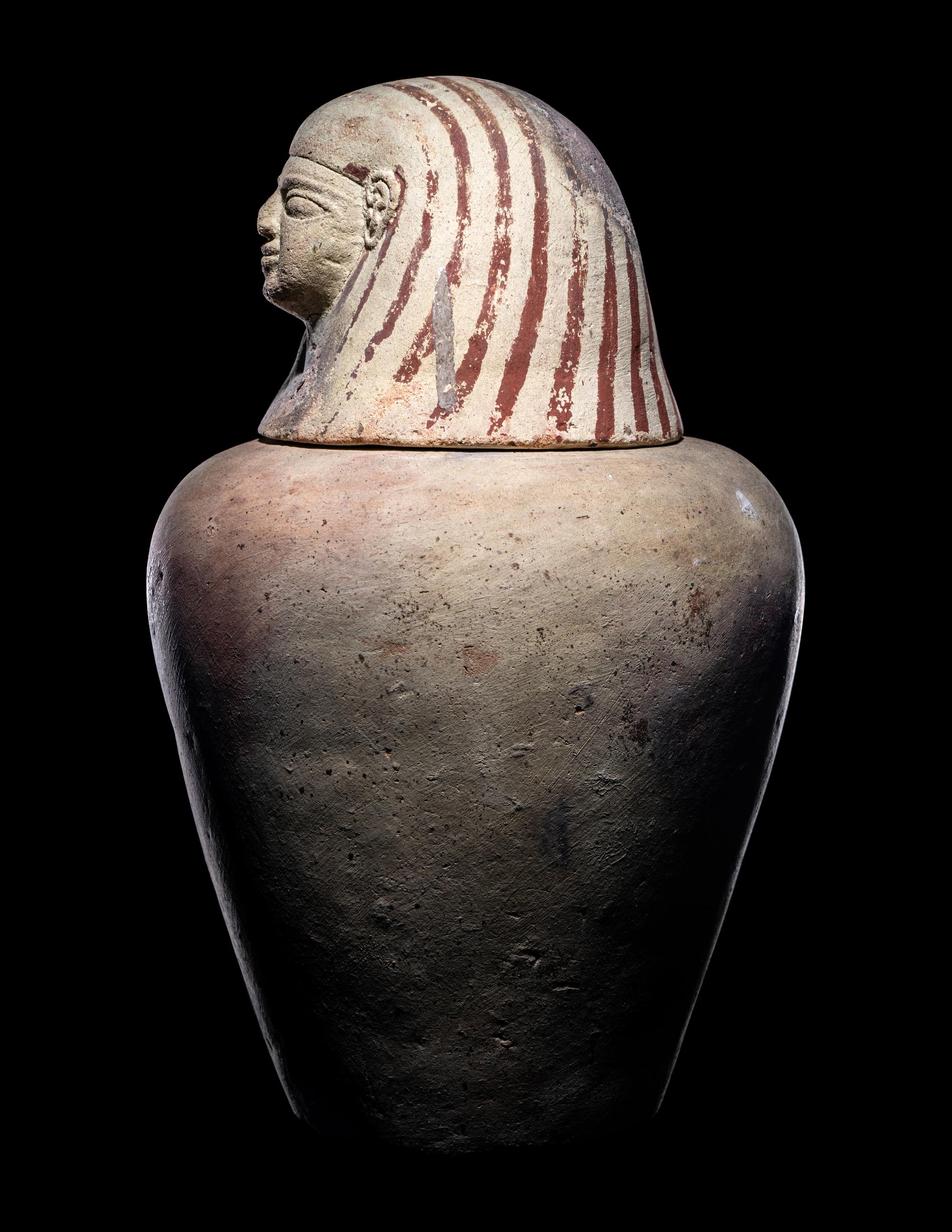 An Egyptian Painted Pottery Canopic Jar