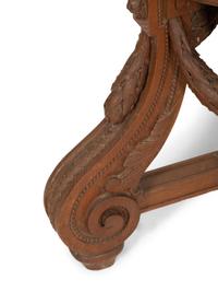 An Italian Carved Walnut Tripod Pedestal Table