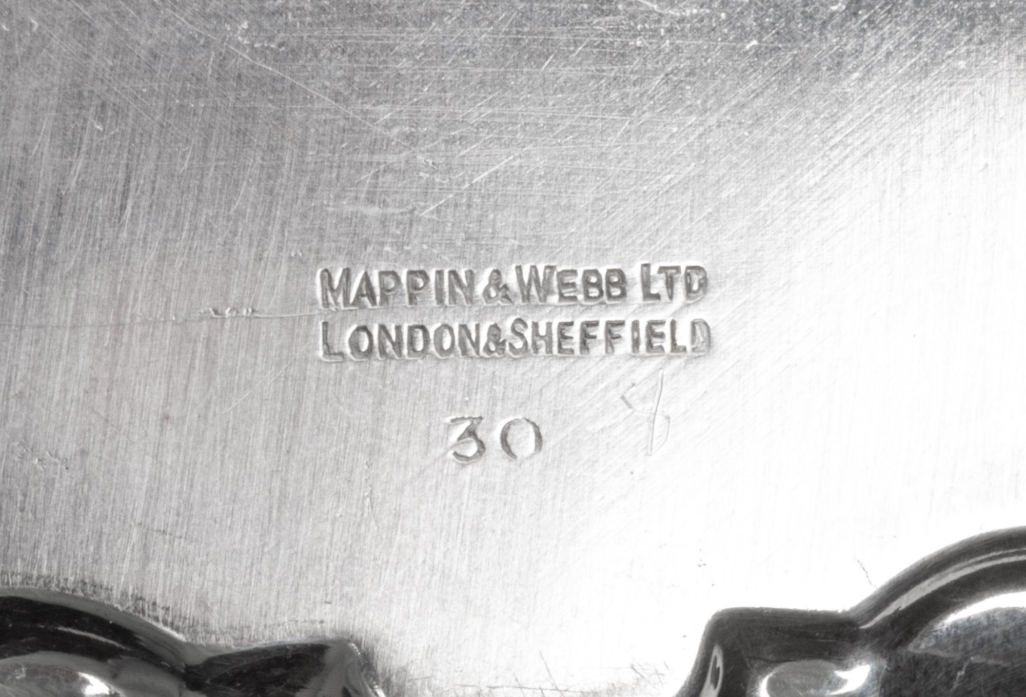 A Group of Four English Silver Waiters