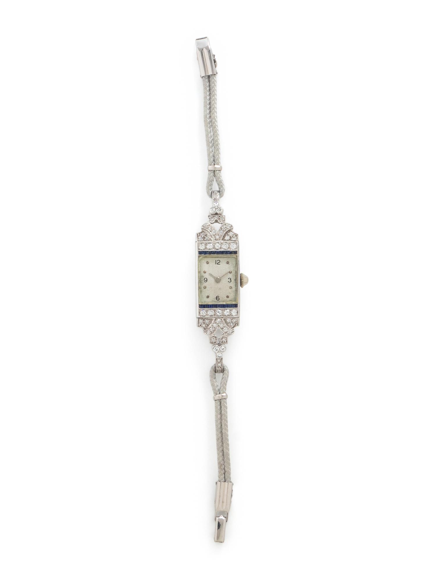 DIAMOND, SAPPHIRE, AND PLATINUM WATCH