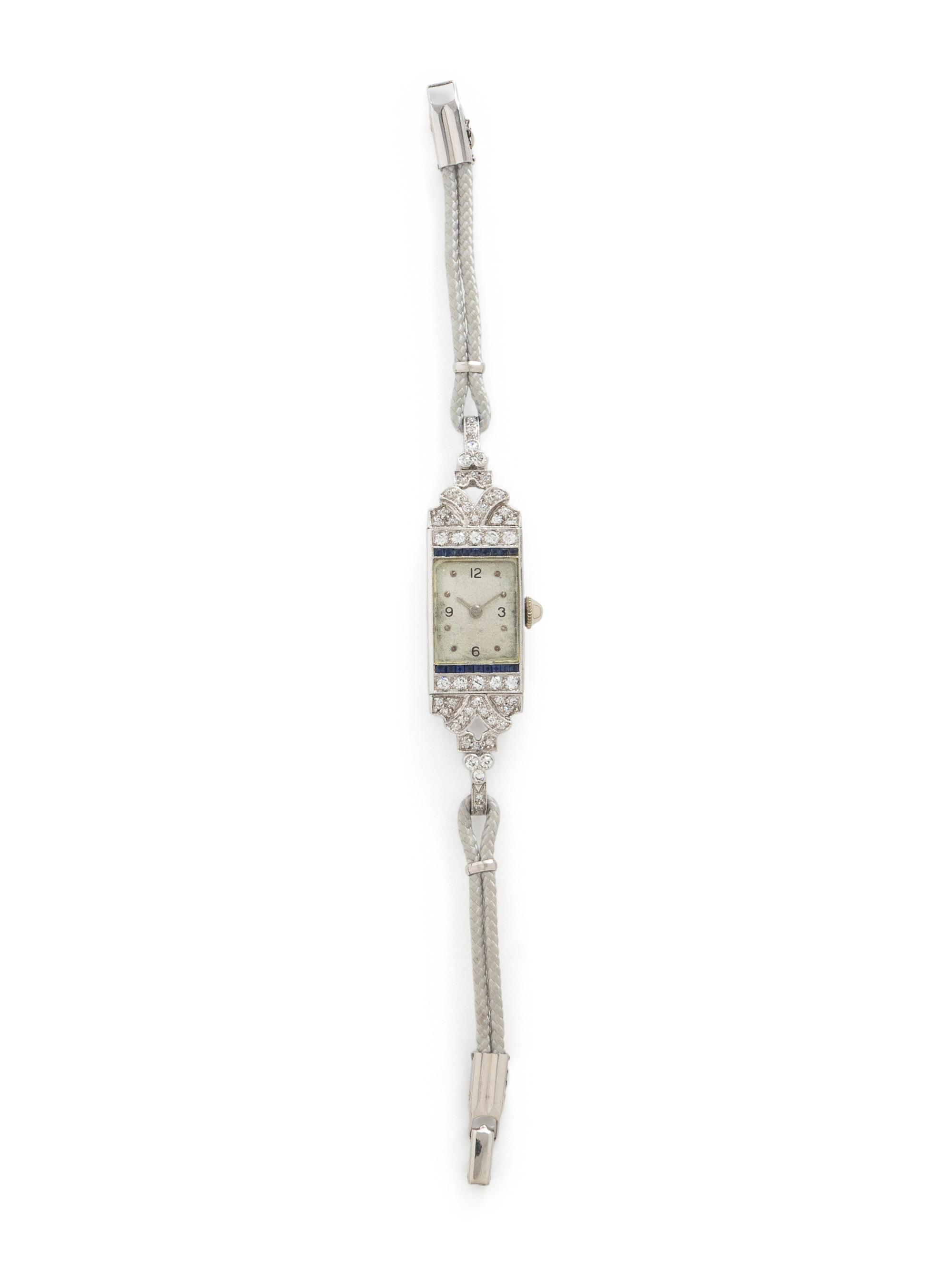 DIAMOND, SAPPHIRE, AND PLATINUM WATCH