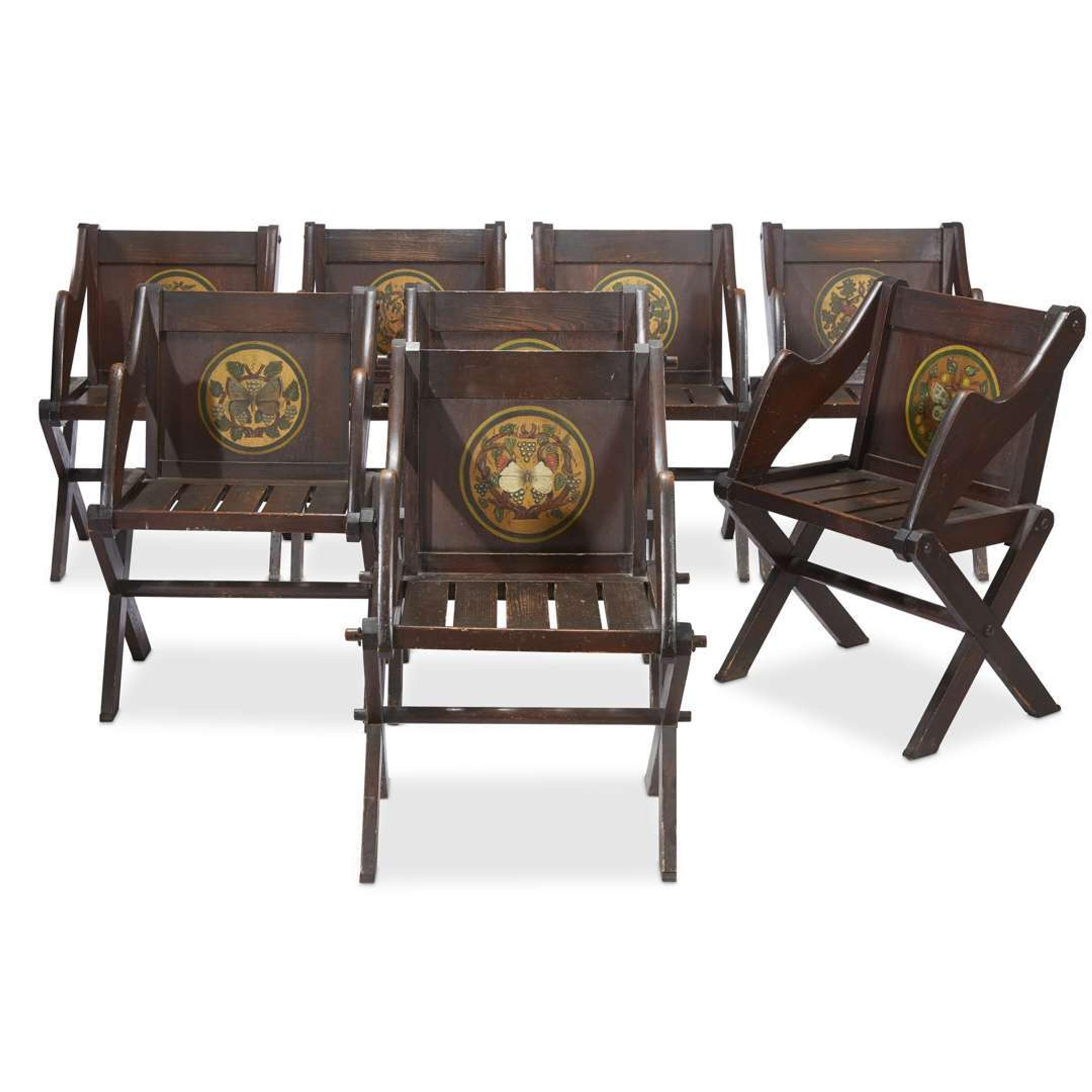 Set of eight stained and paint-decorated pine Gothic Revival 'Glastonbury-type' armchairs after a design by A.W. Pugin (1839-1841), circa 1900