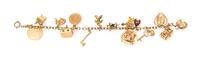 A Vintage 14 Karat Gold Charm Bracelet with 15 Attached Charms, 23.70 dwts.