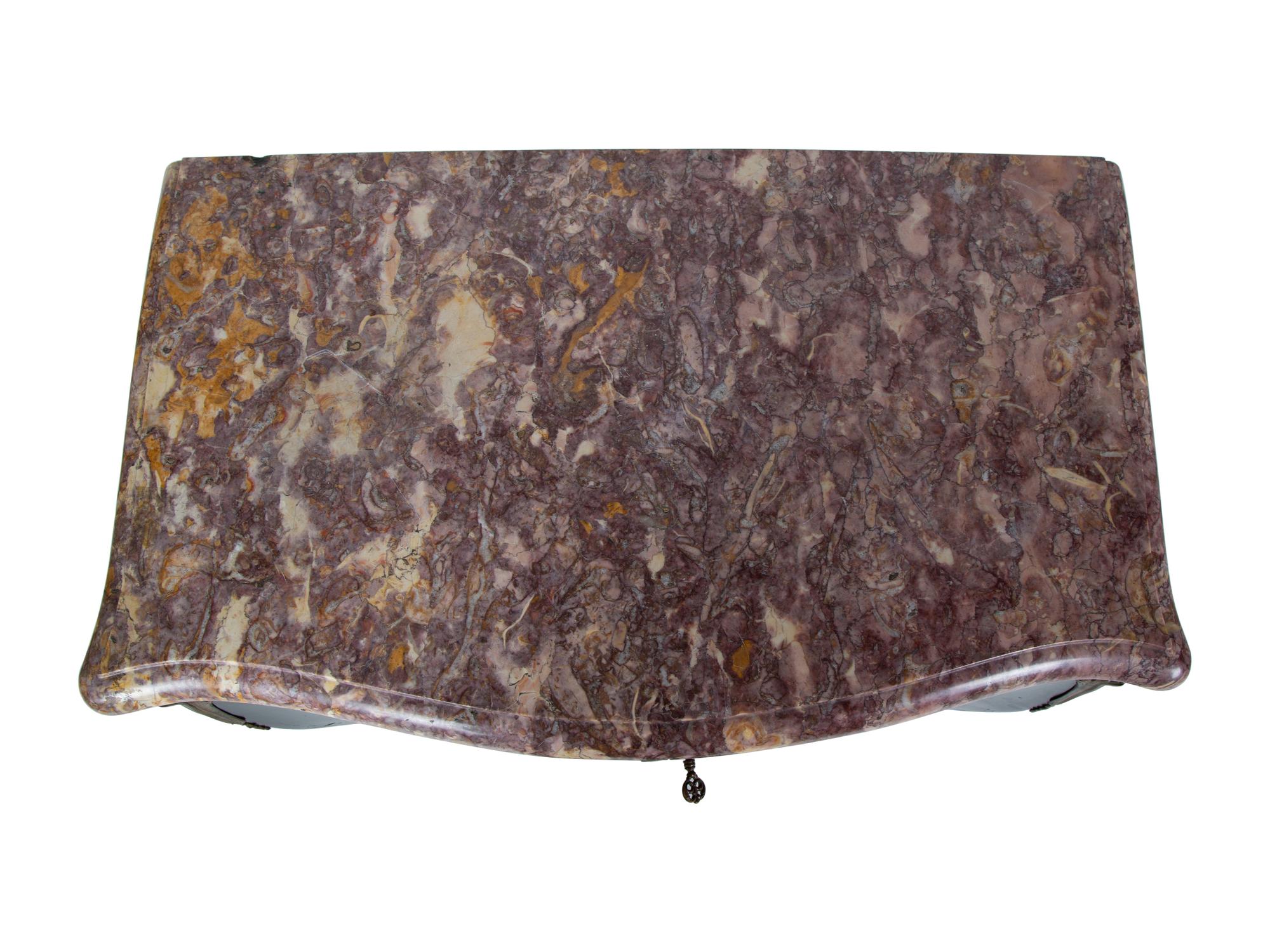 A Transitional Louis XV/XVI Style Gilt Bronze Mounted Ebonized Marble-Top Commode