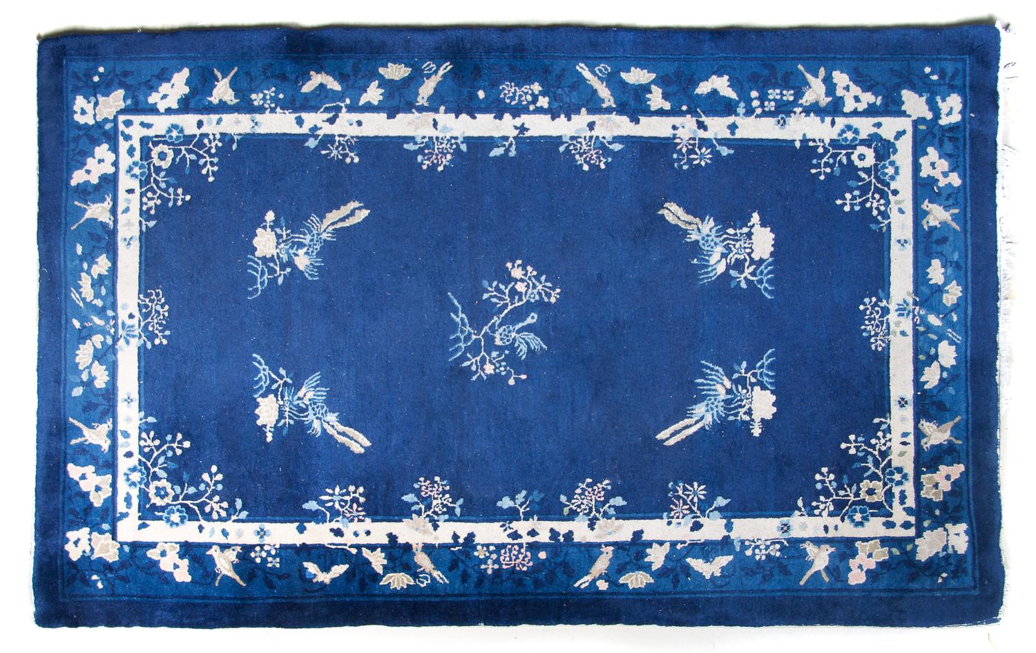 A Chinese Wool Carpet, 7 feet 9 inches x 5 feet 2 inches.