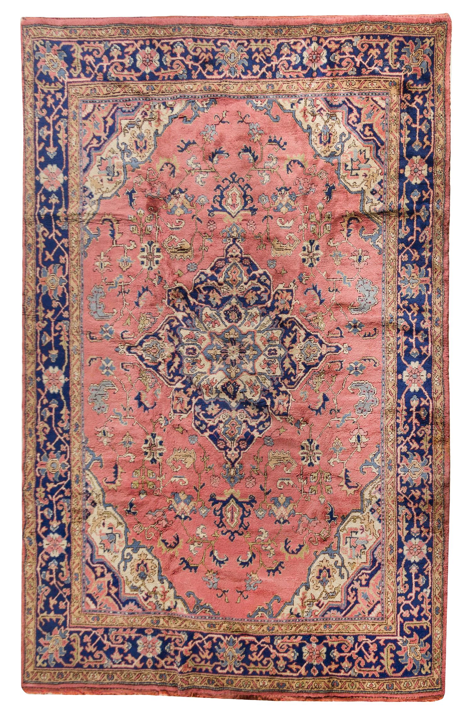 An Oushak Wool Rug 12 feet 3 inches x 9 feet.