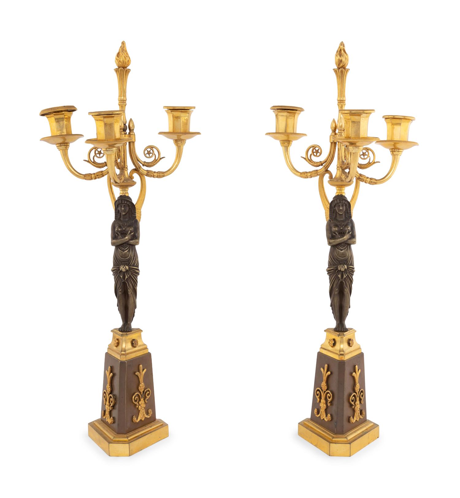 A Pair of Empire Style Gilt and Patinated Bronze Figural Candelabra
