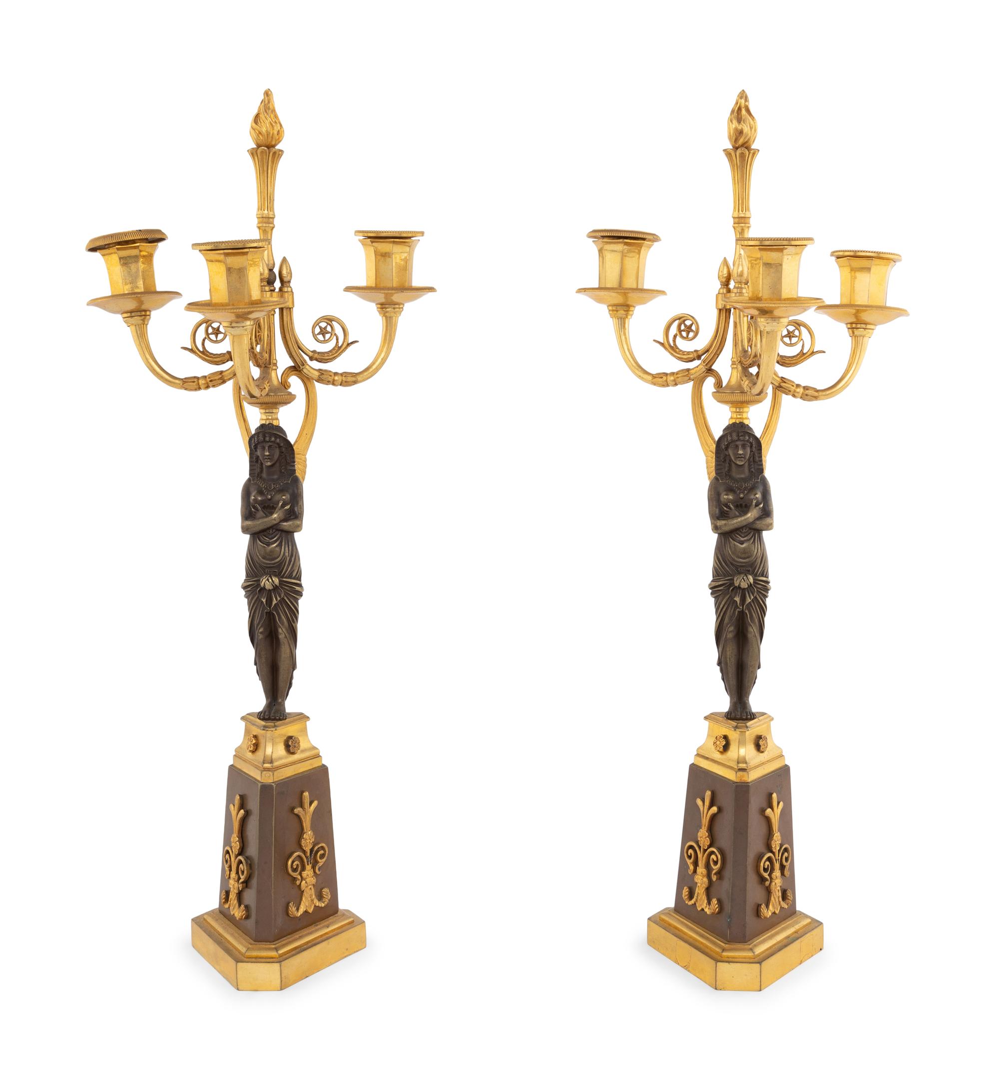 A Pair of Empire Style Gilt and Patinated Bronze Figural Candelabra
