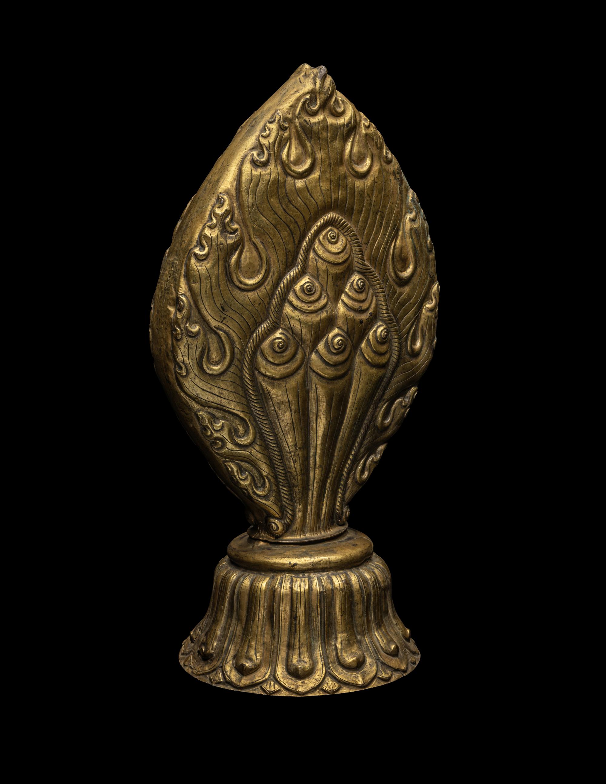 A Nepalese Repoussé Gilt Bronze Flaming Jewel Altar Piece