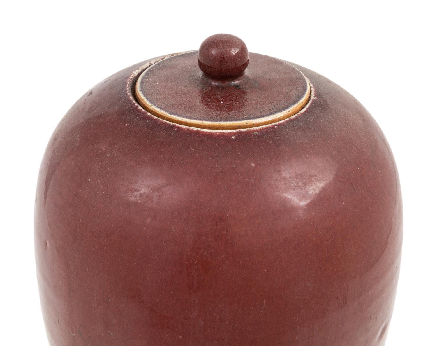 A Pair of Chinese Sang-de-Boeuf Porcelain Covered Jars