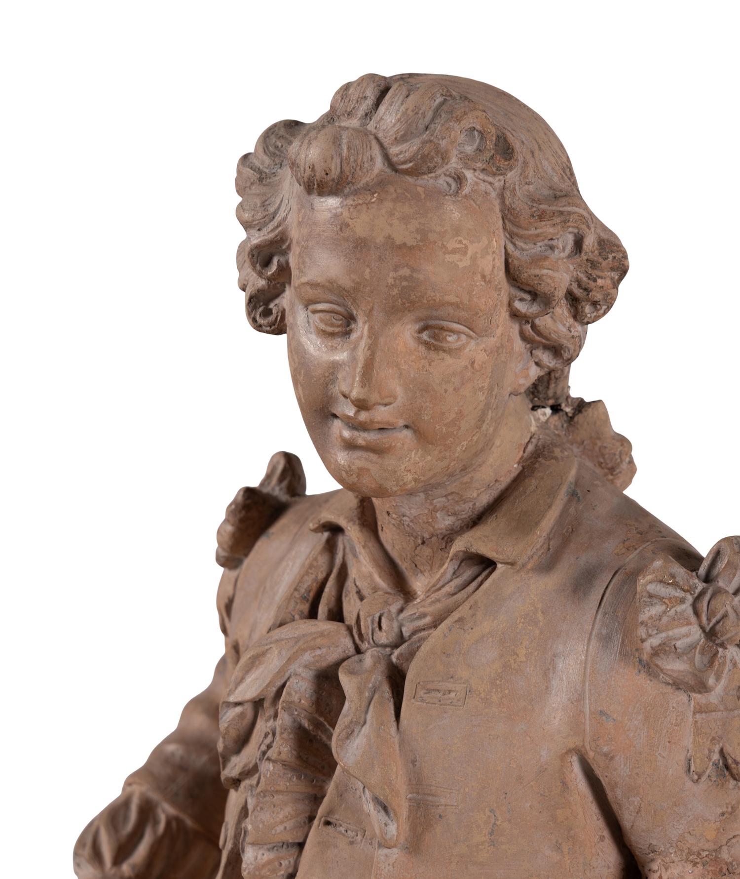 A Continental Terra Cotta Figure