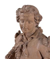 A Continental Terra Cotta Figure