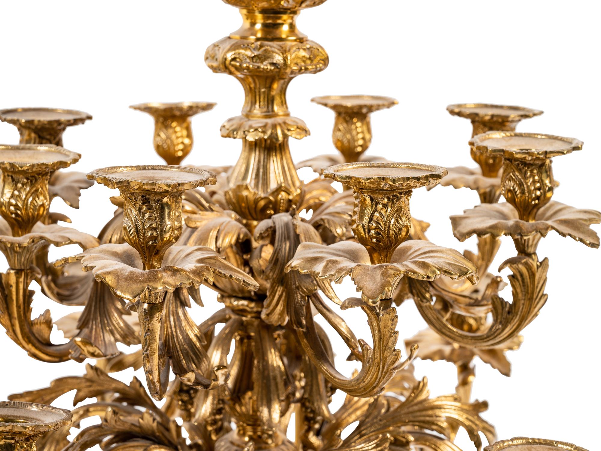 A Pair of Continental Gilt Metal Sixteen-Light Candelabra