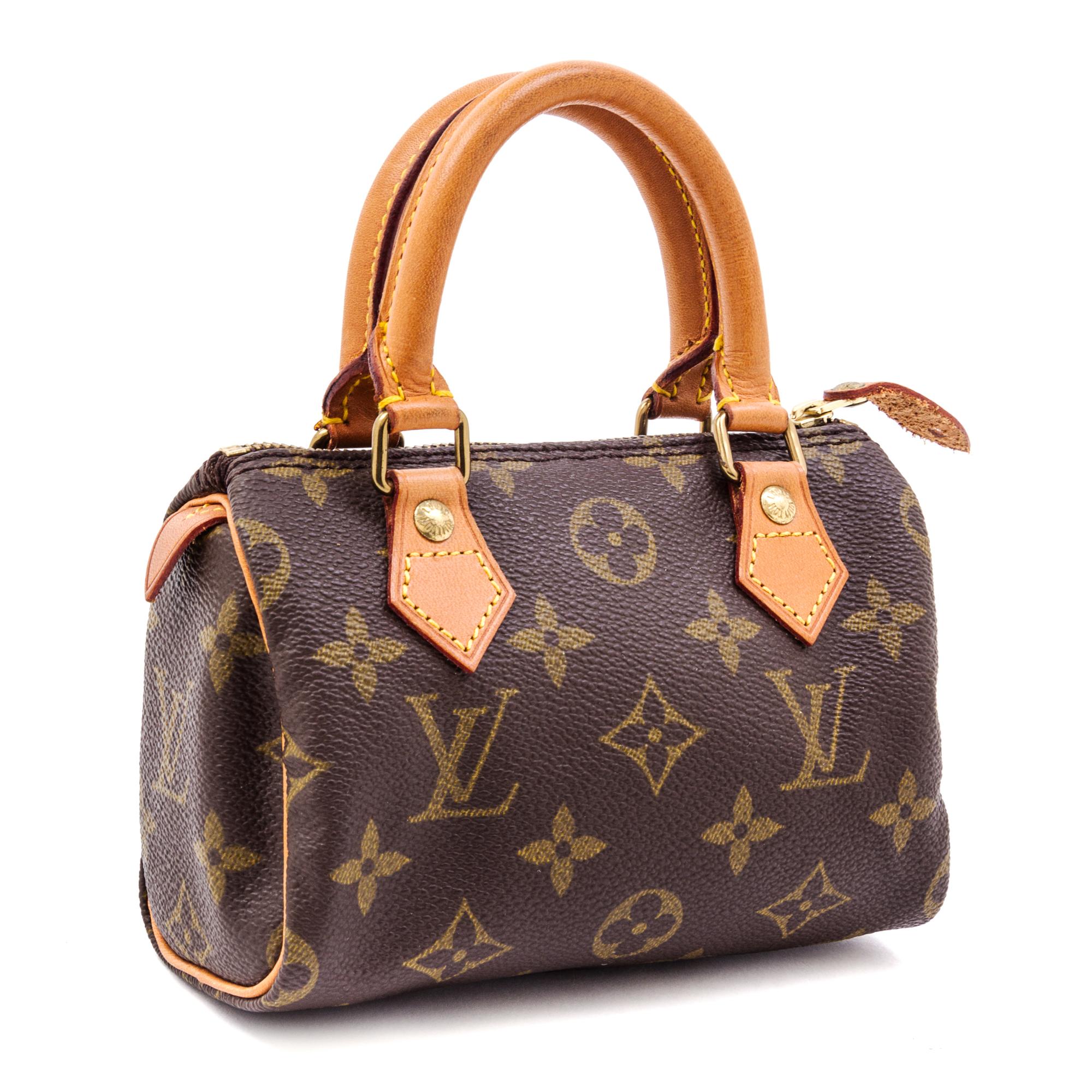 A Louis Vuitton Monogram Canvas Mini Handbag, 6.5" x 4.5" x 3".